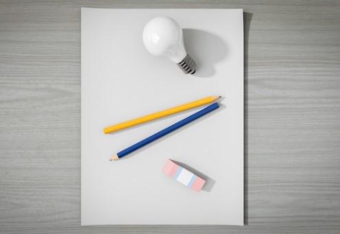 A lightbuld, paper and pencils.