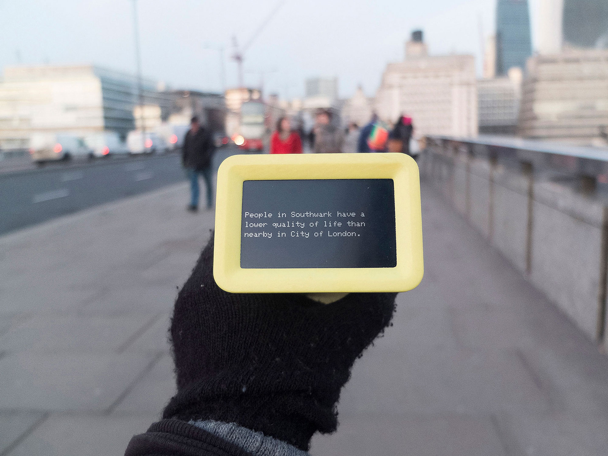 A photograph of the Datacatcher device being viewed on a bridge in London