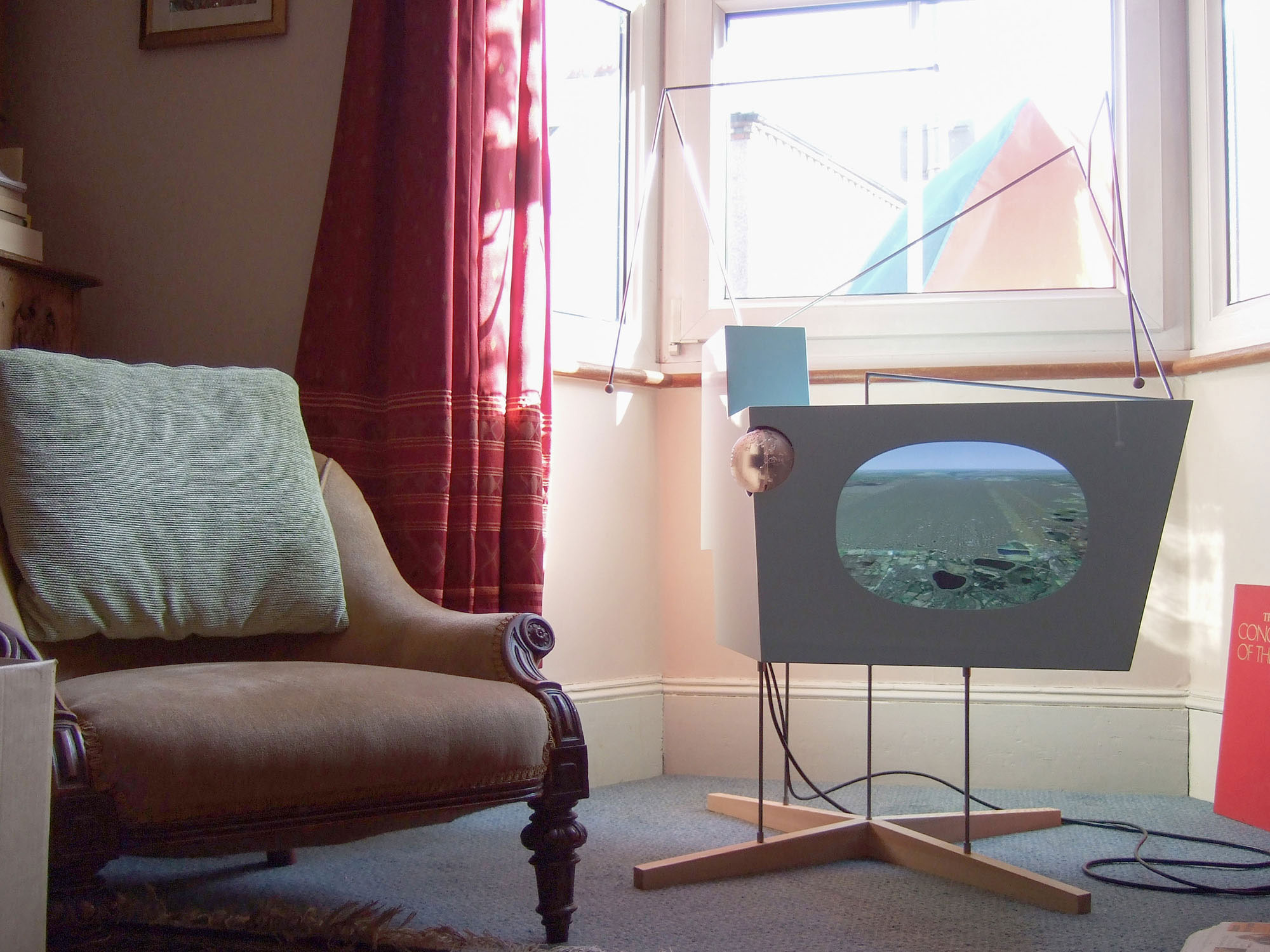 A photograph of the Plane Tracker in the living room of a participant